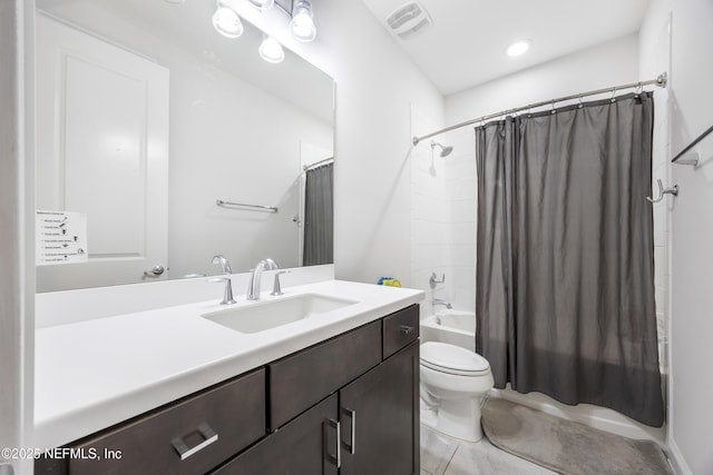 full bathroom with shower / bath combo with shower curtain, toilet, vanity, and tile patterned flooring