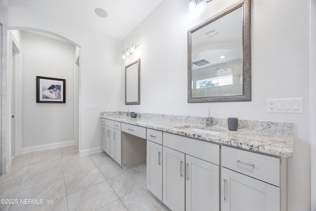 bathroom featuring vanity, walk in shower, and tile patterned floors