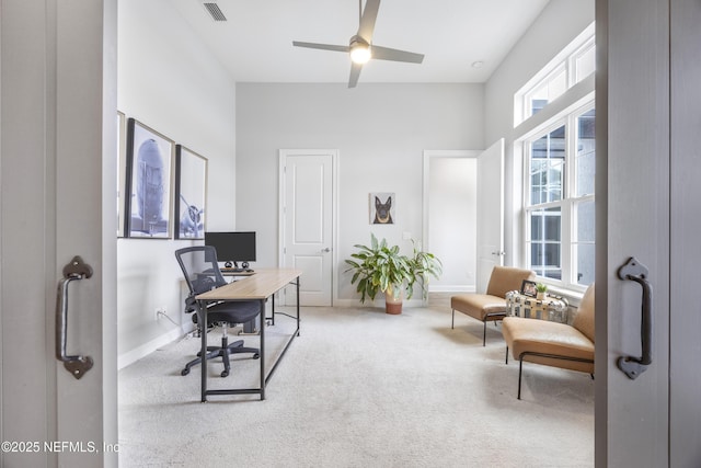 office space featuring carpet and ceiling fan