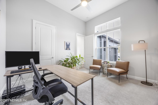 home office with light carpet and ceiling fan