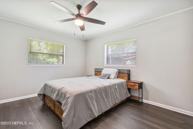 bedroom featuring ceiling fan, dark hardwood / wood-style floors, and crown molding