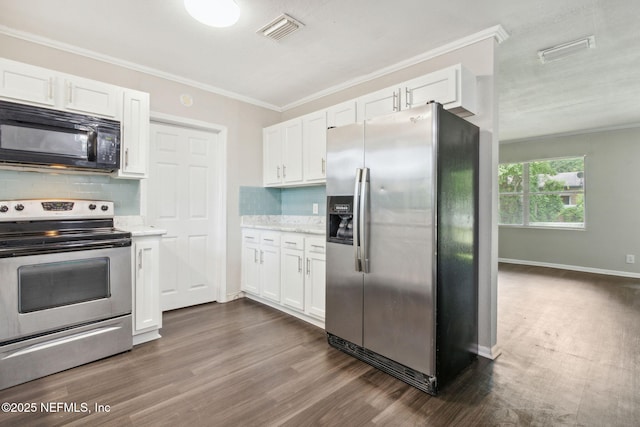 kitchen with tasteful backsplash, dark wood-type flooring, white cabinets, and stainless steel appliances