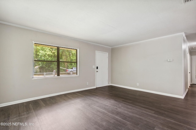 empty room featuring dark hardwood / wood-style floors and ornamental molding