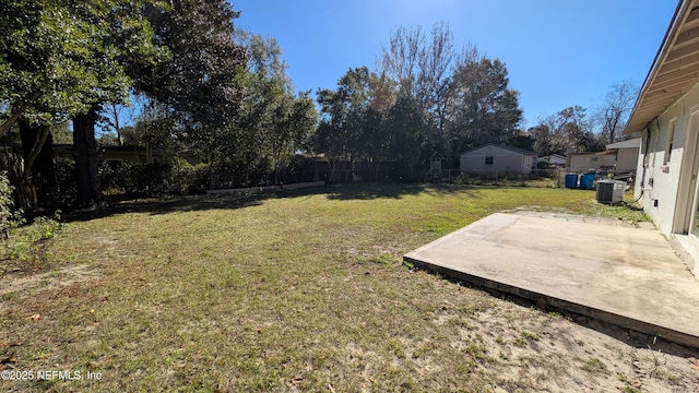 view of yard featuring a patio area and central AC