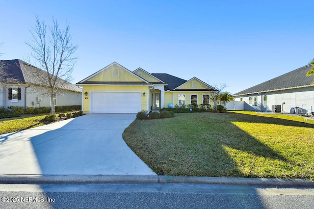 view of front of property featuring a garage, central AC unit, and a front yard