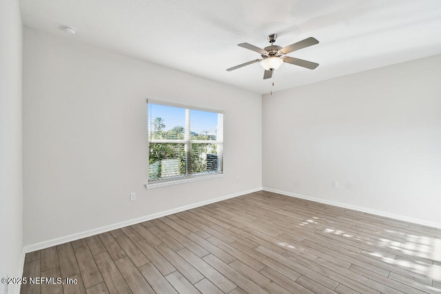 unfurnished room with ceiling fan and light hardwood / wood-style floors