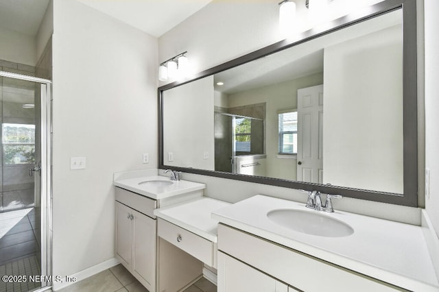 bathroom featuring an enclosed shower, tile patterned floors, and vanity