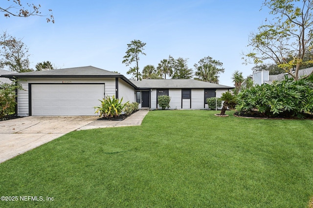 single story home featuring a garage and a front lawn