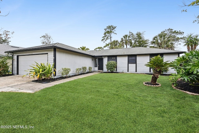 single story home with a garage and a front lawn