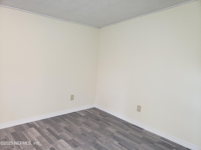 empty room with dark wood-type flooring