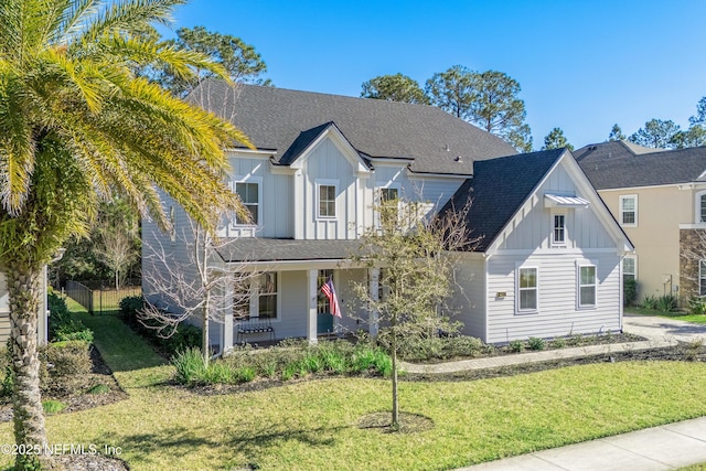 view of front of house with a front lawn and a porch