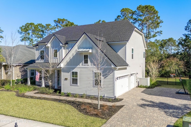 view of front of house featuring a garage and a front yard