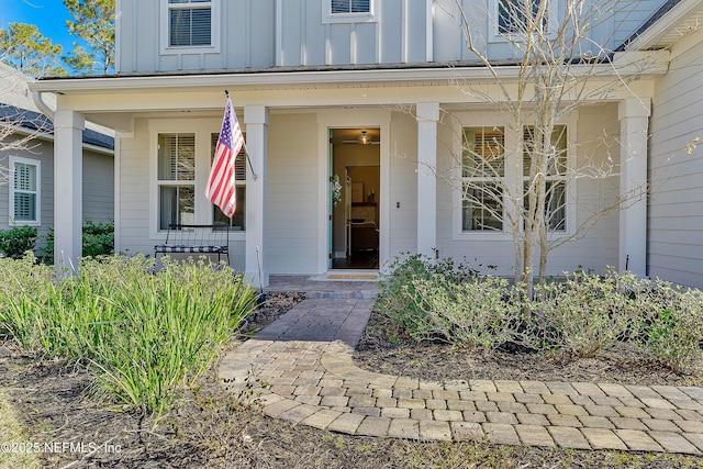 doorway to property featuring covered porch