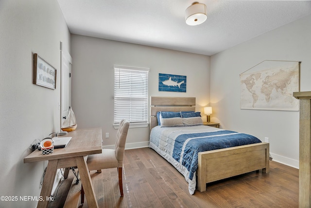 bedroom with wood-type flooring