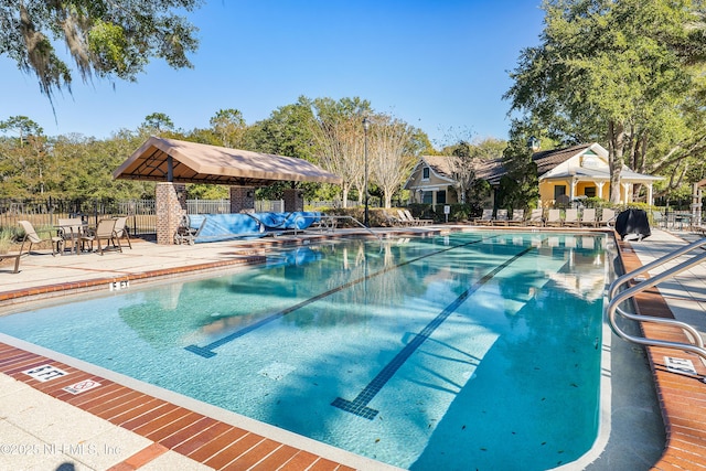 view of swimming pool featuring a patio area