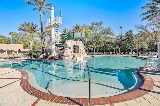 view of pool with a water slide