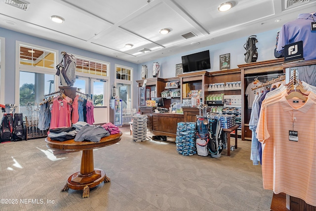 miscellaneous room featuring light carpet and coffered ceiling