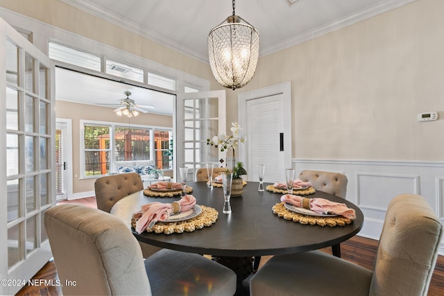 dining room with french doors, ceiling fan with notable chandelier, and crown molding