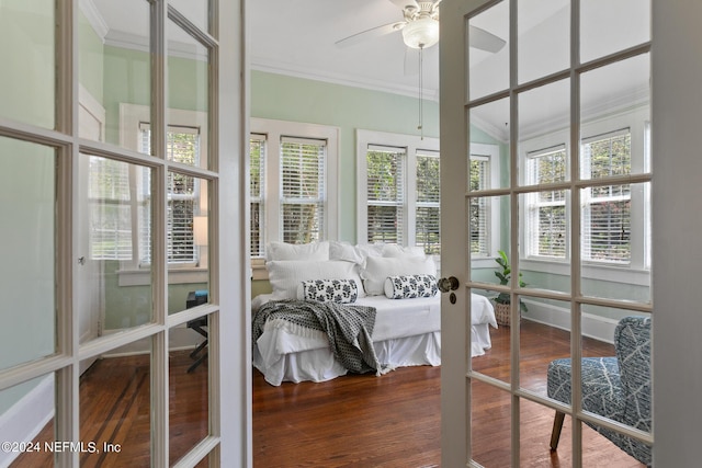 sunroom featuring ceiling fan