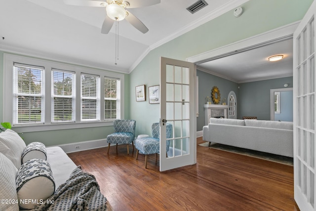 sitting room with plenty of natural light, ceiling fan, french doors, and vaulted ceiling