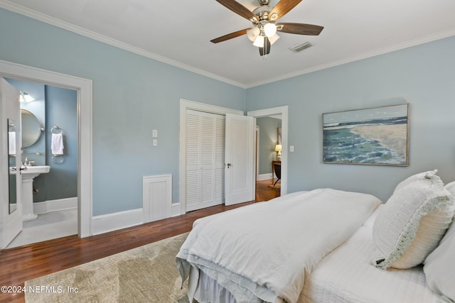 bedroom with ceiling fan, ensuite bathroom, wood-type flooring, a closet, and ornamental molding