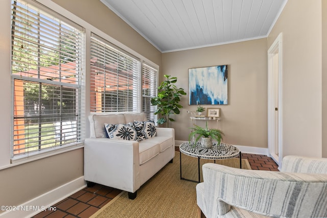 living area with ornamental molding and wooden ceiling