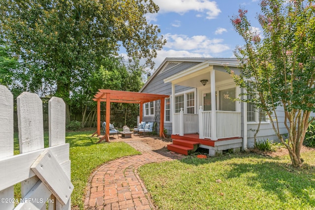 view of front facade with a front yard and a pergola