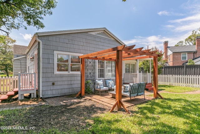 rear view of house featuring an outdoor hangout area, a pergola, and a yard