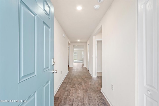 corridor with wood-type flooring