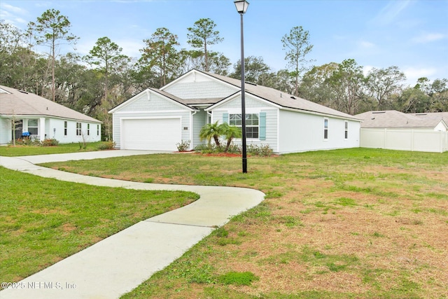 view of front facade featuring a front lawn and a garage