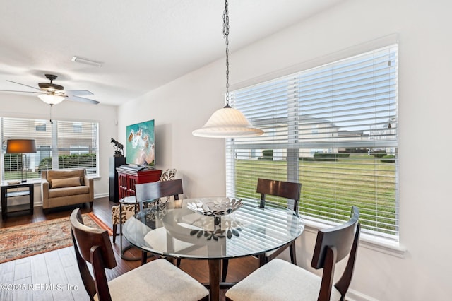 dining room featuring hardwood / wood-style flooring and ceiling fan