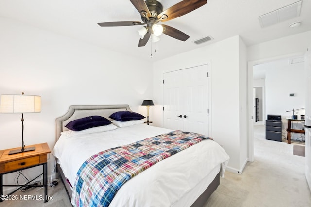 carpeted bedroom with a closet and ceiling fan