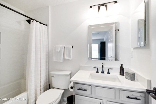 full bathroom with vanity, shower / bath combination with curtain, and toilet