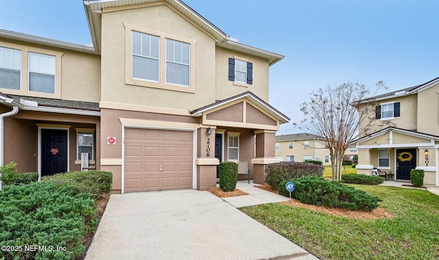 view of front facade with a garage and a front lawn