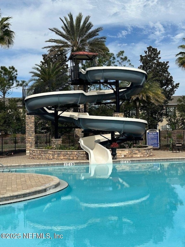 view of pool featuring a water slide