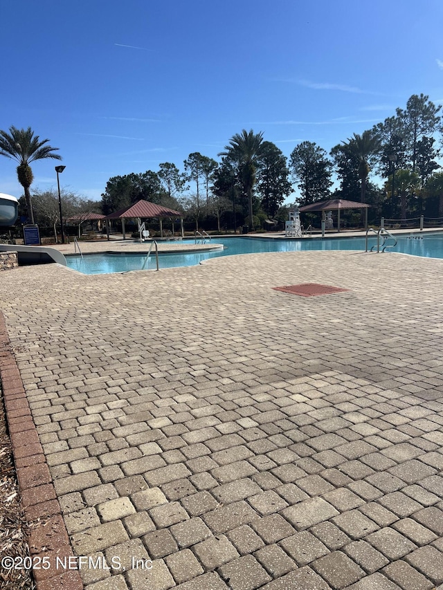 view of swimming pool with a gazebo