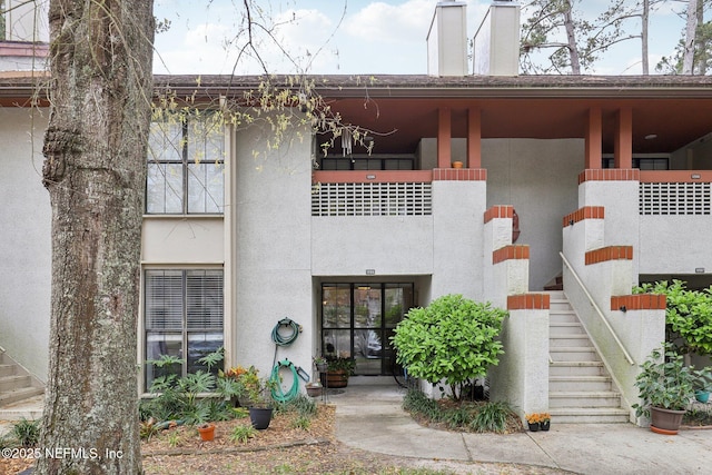 view of property with stairway