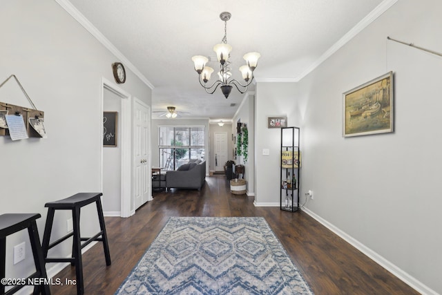 interior space featuring wood finished floors, a chandelier, and ornamental molding