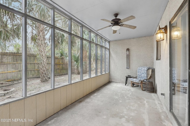 sunroom with a ceiling fan and a healthy amount of sunlight