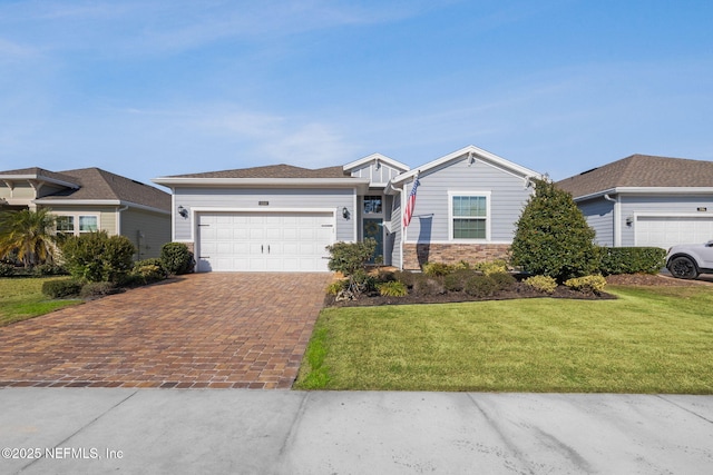 ranch-style home with a front lawn and a garage