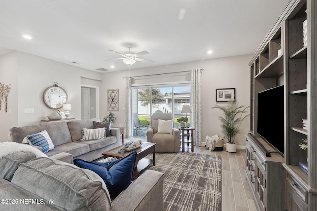 living room featuring ceiling fan