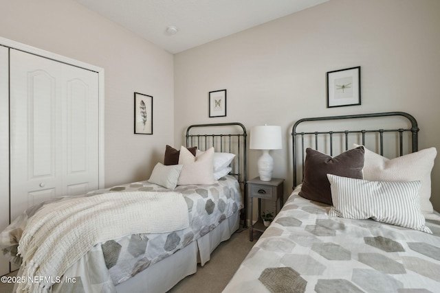 carpeted bedroom featuring a closet