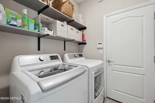 washroom featuring independent washer and dryer