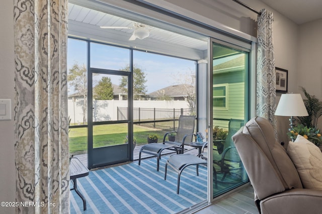 sunroom / solarium with ceiling fan