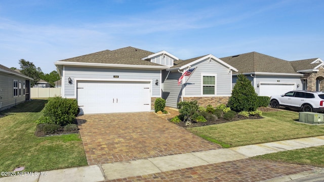 view of front of home with a garage and a front yard