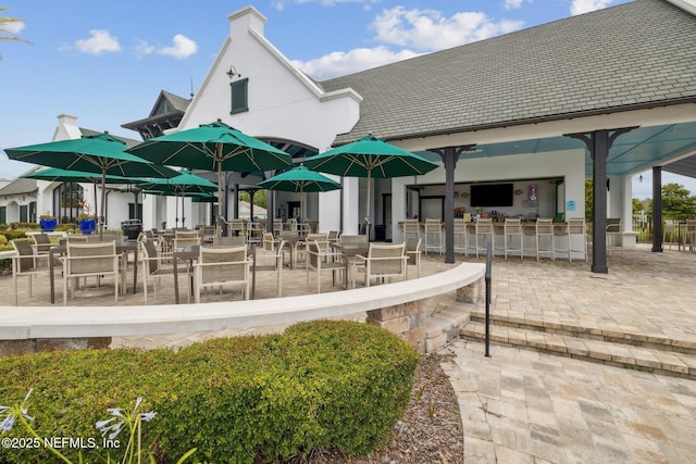 view of property's community featuring a patio area