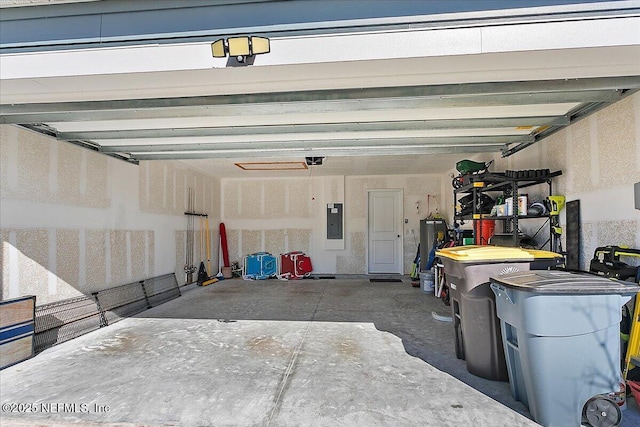 garage with electric panel and a garage door opener