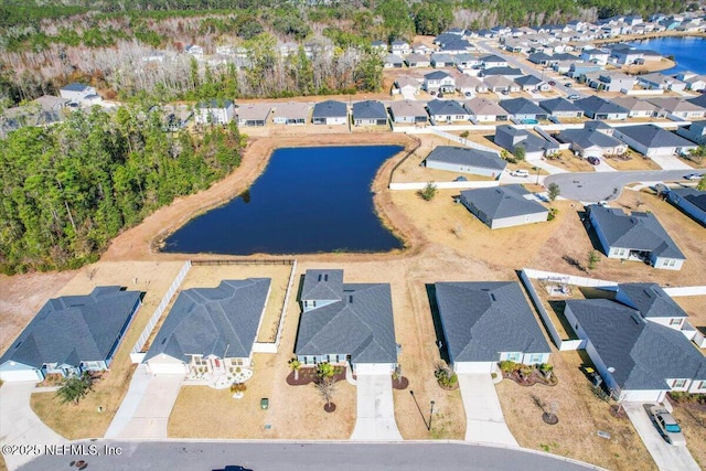 aerial view with a residential view and a water view