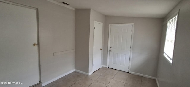 interior space featuring light tile patterned floors