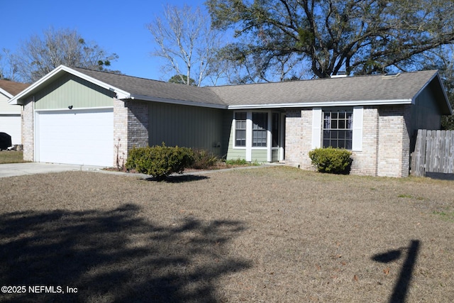 ranch-style house with a front yard and a garage